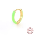 Macro shot of 925 sterling silver gold plated hoop earring with green enamel finish - Gold-Light Green