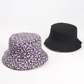 Detail of reversible leopard print and solid black canvas sun hats on white backdrop - M (56-58cm) / Purple