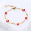 Bracciale in acciaio inossidabile dorato con fiori in smalto rosso e piccoli ciondoli - Fiore Rosso