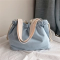 Light blue canvas drawstring tote bag with off-white handles and spacious cotton rope closure - Light Blue