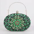 Detailed macro view of green crystal flower clutch with gold frame and spherical clasp - Green