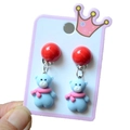 Close-up of handmade cartoon bear earrings with pink scarf and red bead detail - Style 20 Blue Bear Dangle