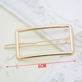 Close-up of 6cm golden minimalist rectangular hair clip on elegant relief background - Rectangle Gold