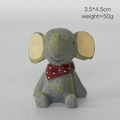 Miniature resin elephant figurine wearing a red polka dot scarf, looking upwards 4.5cm - Elephant with Red Scarf