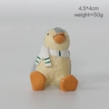 Miniature resin penguin figurine wearing a striped scarf, 4.5x4cm decorative ornament - Small Penguin