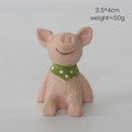 Miniature pink pig resin ornament with green polka dot scarf and 3.5x4cm dimensions - Pig (A11-456-19)
