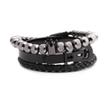 Juego de tres pulseras para hombre con corona, cuentas y cuero trenzado en color negro - Color gunmetal