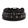 Macro shot of black beaded bracelet set with crown charm and Roman numeral bangle detail - Black White Zircon Crown 4-Piece Set