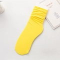 Bright yellow breathable velvet slouch socks with a stylish rolled cuff design - One Size / Bright Yellow