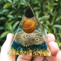 Tiger Eye stone Orgone Pyramid with brass gear and blue chips held in hand - XQK12 Glass Clock