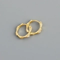 Detailed view of gold bamboo hoop earrings with small crystals on a grey background - Bamboo Joint Hoop Earrings (S-E1555) / Gold
