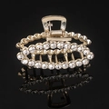 Close-up of golden hair claw clip with sparkling rhinestones and pearls on black background - Gold Full Rhinestone Oval Claw Clip