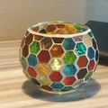 Spherical mosaic glass candle holder with colorful hexagonal tiles and warm candlelight - Radiant Honeycomb