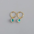 Close-up of golden hoop earrings featuring oval turquoise pendants with textured edges - Oval Rhinestone Earrings (S-E1532) / Gold