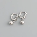 Detailed view of silver hoop earrings with a polished metallic bead charm - Smooth Bead Hoop Earrings (S-E1563) / Silver