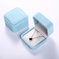 Detail view of two sky blue velvet jewelry boxes, showing both open and closed styles - 7x7 Medium Pendant Box / Aqua White
