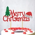 Merry Christmas cake topper with glitter green tree and red Santa hat on white cake - Christmas Tree
