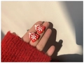 Close-up of red Christmas bell earrings with white snowflakes held in hand - Christmas Bell (S925 Silver Pin)