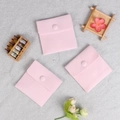 Set of pink velvet jewelry pouches with snap buttons on a textured silver background - Double-sided Plush Style (Pink) / 7x7cm