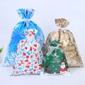 Assorted Christmas drawstring gift bags in multiple sizes with festive holiday patterns - Set of 30 in 4 Styles