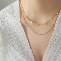 Double-layered golden stainless steel necklace with tiny rhombus charms worn on a model - Gold Color (40/45+5cm)