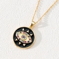 Detailed macro shot of a gold-plated evil eye pendant with colorful zircon stones - Style K-Black Enamel Colorful Eye