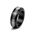 Macro detail of men's black titanium band with silver Celtic dragon inlay and rotatable design - US 7 / Silver Dragon Pattern