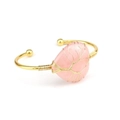 Detail of handmade gold wire-wrapped heart-shaped pink crystal tree of life bangle - Rose Quartz