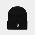 Close-up of a black knitted beanie featuring detailed yellow banana embroidery on the cuff - Banana / Black