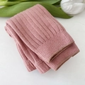 Close-up detail view of soft pink ribbed knit toddler tights, delicate texture and cozy fit. - S / Pink