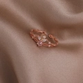 Detail of rose gold ring with pear-cut yellow gem and pink stone on champagne satin - Pink Three-Petal Flower (Rose Gold) (21701A)
