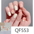Close-up of matte QF-553 nail stickers featuring peach daisy dots and gold foil details - QF553