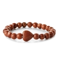 Close-up of brown goldstone beaded bracelet with a heart-shaped centerpiece on white background - Gold Sandstone