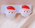 Close-up of cute 3D resin Santa Claus clip-on earrings for kids on a white card - 9# Santa Claus / Clip-on Earrings Pair