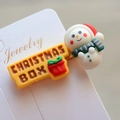 Detailed view of Christmas snowman and gift box resin hair clips on jewelry card - Style 29 Christmas Hair Clip