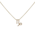 Detailed close-up of a golden Capricorn zodiac necklace with shimmering zircon stones - Gold Capricorn