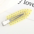 Macro shot of pale yellow flower hair clip with pearls and rhinestones on silver metal - Yellow