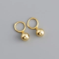 Detailed view of polished golden hoop earring with a sleek spherical metal drop pendant - Metal Ball - Gold