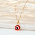Gold stainless steel evil eye necklace with red enamel pendant on textured background - 18K Gold / Red Necklace