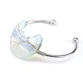 Detail of silver wire-wrapped tree of life bangle with opal crescent moon charm - Synthetic Opal