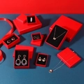 Elegant red jewelry gift boxes with ribbons for necklaces, earrings and rings display - Textured Red