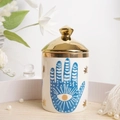 White ceramic jar with blue evil eye and hand patterns with golden star and lid - Hamsa Hand Small Jar