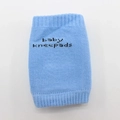 Light blue breathable cotton baby kneepads with elastic cuffs and decorative text - Blue