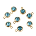 Detailed view of round blue crystal birthstone charms with gold plated stainless steel edges - Blue Stone Gold Base