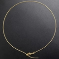 Detail view of gold-plated snake chain necklace with adjustable slider clasp and tail chain - Necklace / Gold