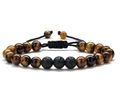 Close-up of tiger eye and lava stone beads on a black braided adjustable bracelet - Tiger Eye + 3 Volcanic Beads