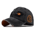 Washed black baseball cap with orange eye embroidery and side apparel patch - Adjustable / Black