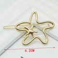 Close-up of golden metal starfish hair clip with 6.2cm double hollow design detail - Starfish Shape Gold