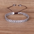Men's punk handmade braided hematite bracelet with grey arrow-shaped beads on wood - Silver Arrow / Silver