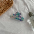 Detail view of medium acetate hair claw clip with colorful marble aurora pattern - Medium Square Claw / Fantasy Blue